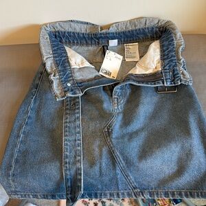 H&M Jean skirt with belt, worn once, still with tag. Flattering & comfortable!